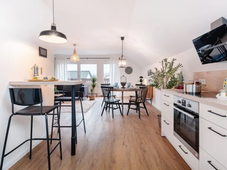 Open-plan kitchen and dining area at PEARL SILVER
