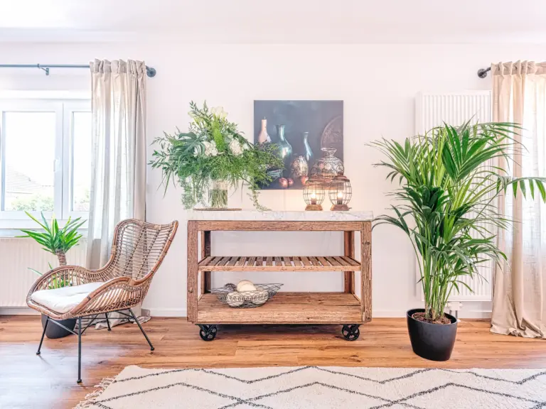 Stylish decor and plants in the dining area at PEARL WHITE