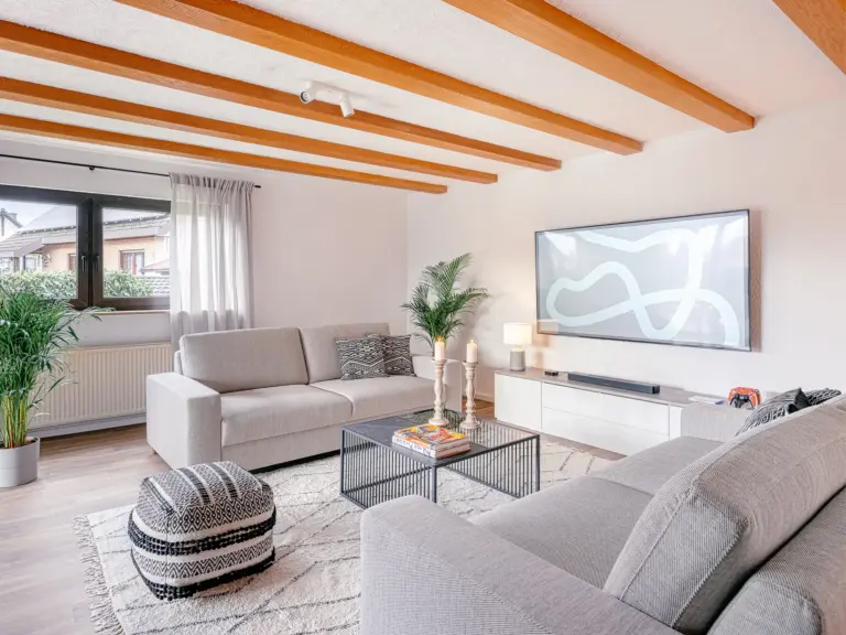 Comfortable sofas and TV in the living room at RUBY RED