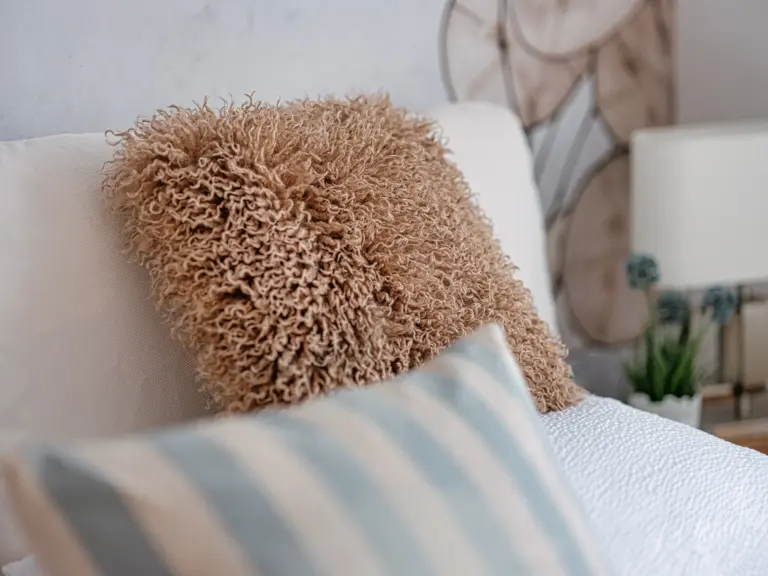 Comfortable bedding and decorative pillows at PEARL SILVER