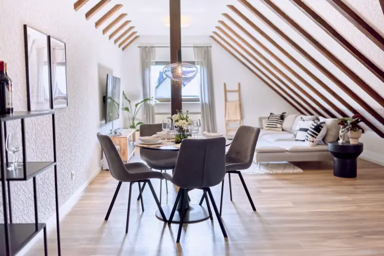 Modern dining area with seating for four at RUBY NOIR