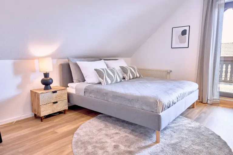 King-size bed in the bright master bedroom at RUBY NOIR