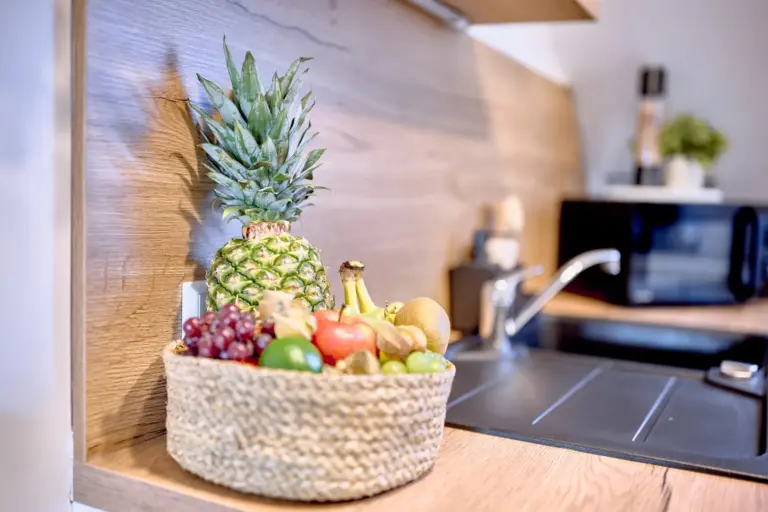 The spacious open-plan interior at RUBY NOIR connects the dining and living areas and includes a dedicated workspace for guests.
