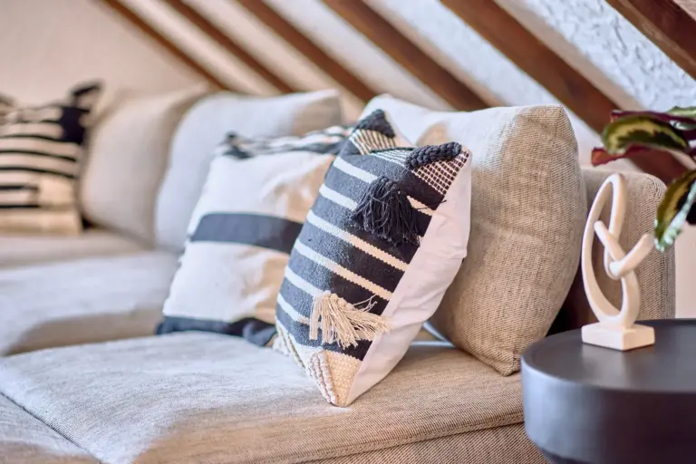 Decorative pillows on seating in the living room at RUBY NOIR