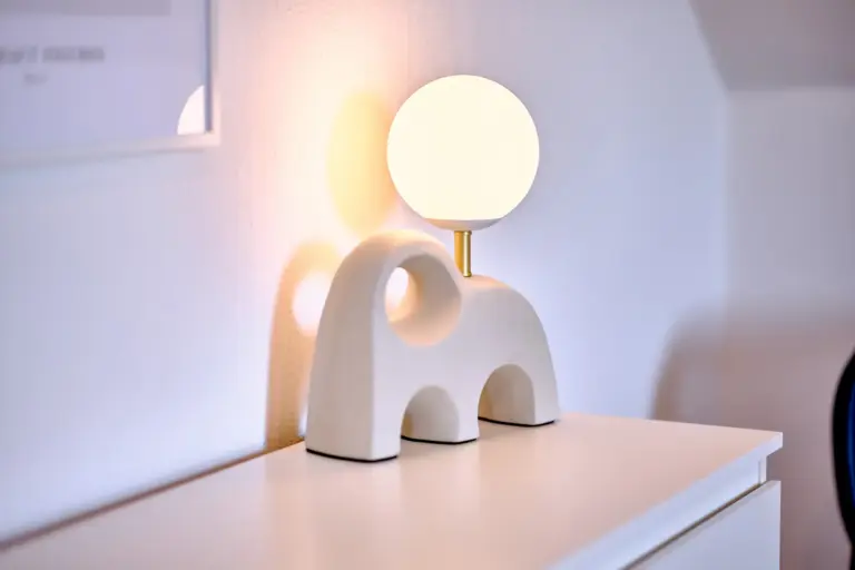 Modern bedside lamp in the master bedroom at RUBY NOIR