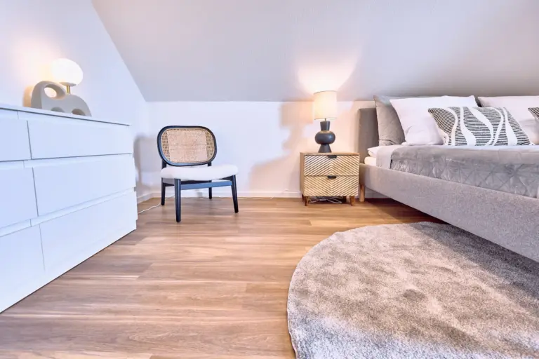 Modern furnishings in the master bedroom at RUBY NOIR