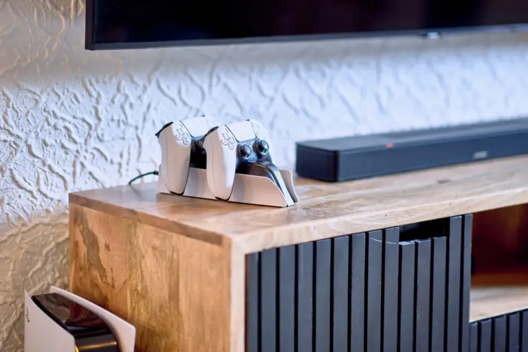 PlayStation 5 controllers and soundbar in the entertainment area at RUBY NOIR