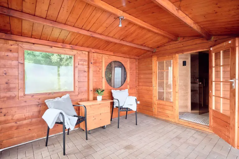 Covered relaxation area outside the private sauna at RUBY RED and RUBY NOIR