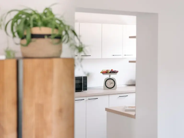 Modern white kitchen with generous counter space at PEARL WHITE