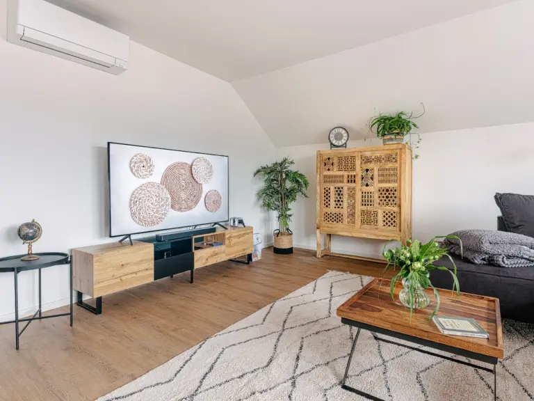 Spacious living room with TV and coffee table at PEARL SILVER