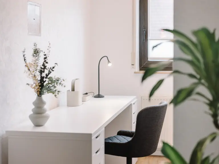 Dedicated workspace with desk and office chair at RUBY RED