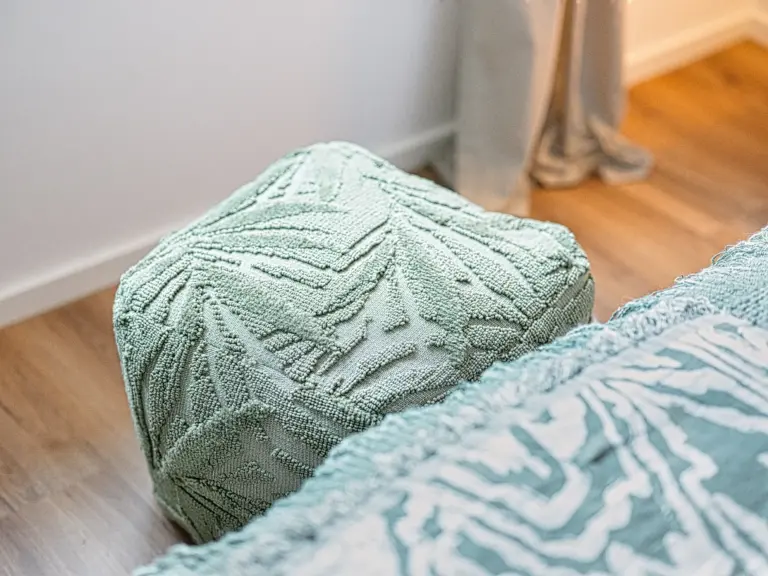 Decorative pouf in the master bedroom at PEARL WHITE