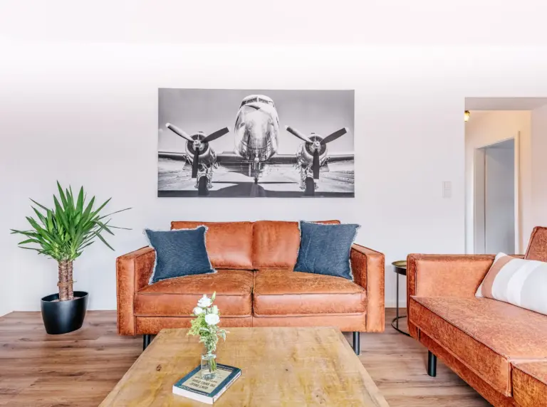 Comfortable sofa and coffee table in the living room at PEARL WHITE
