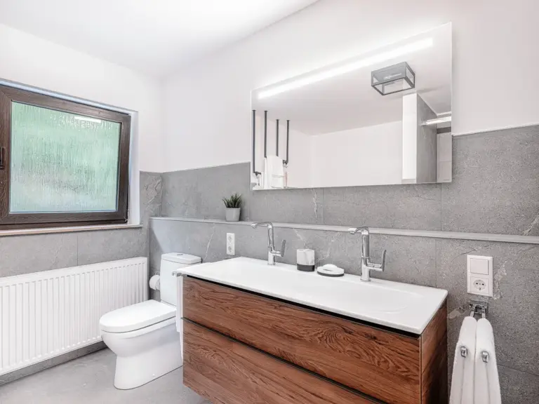 Spacious bathroom vanity with double sink at RUBY RED